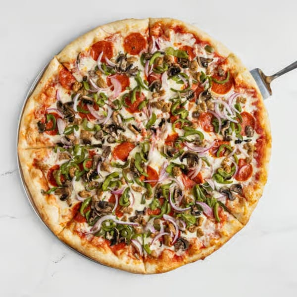 Big City Slices' pepperoni, mushroom, onion, and green pepper pizza on a metal tray.